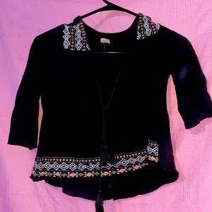 2 crop tops and a long sleeve shirt